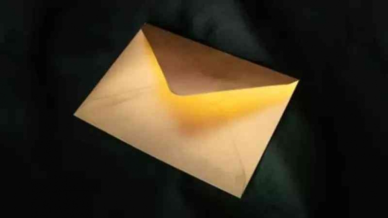 https://www.shutterstock.com/image-photo/mysterious-golden-letter-lying-on-velvet-1890093091