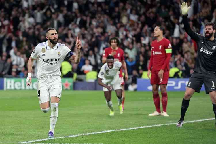 Karim Benzema merayakan gol ke gawang Liverpool. Foto: AFP/PIERRE-PHILIPPE MARCOUA via Kompas.com