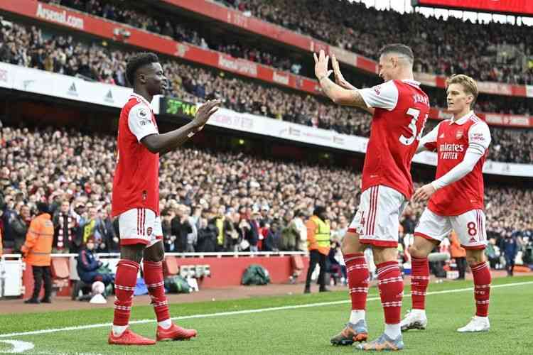 Selebrasi pemain Arsenal usai cetak gol ke gawang Crystal Palace, Minggu (19/3/2023): AFP/JUSTIN TALLIS via Kompas.com