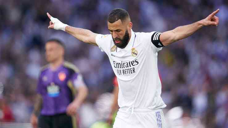 Benzema merayakan gol/goal.com