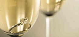 https://www.crowncateringcambridge.com/2017/01/03/congratulations/embrace-bliss-champagne-glasses-with-engagement-ring-574x250/