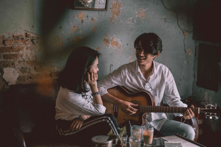 Photo by Mnn Quang: https://www.pexels.com/photo/man-playing-guitar-with-girl-3450887/ 