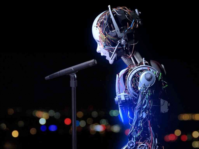 Ilustrasi robot AI sedang bernyanyi | Sumber: istock photo/Devrimb