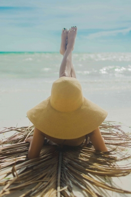 Photo by June Famur Jr.: https://www.pexels.com/photo/woman-wearing-yellow-hat-with-feet-raised-sunbathing-on-shore-2663411/ 