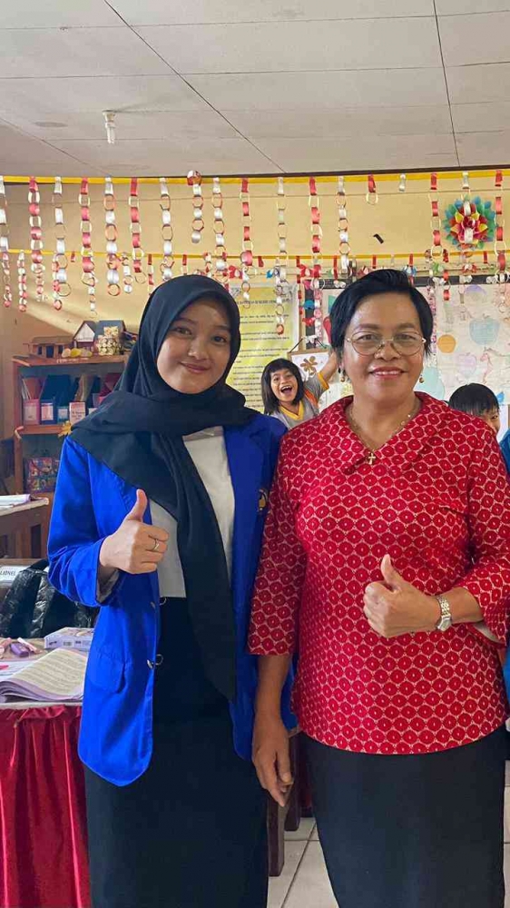 Foto bersama salah satu guru ibu Sjeni Manuarfa S. Pd SD Negeri 2 Tomohon