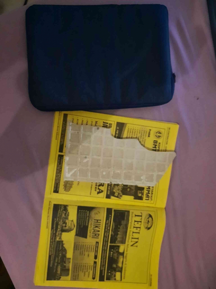 The second victim whose a loose Macbook but replaced it with a book and ceramic.
