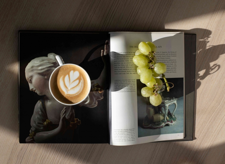 Photo by Jill Burrow: https://www.pexels.com/photo/cup-of-cappuccino-and-grapes-arranged-on-opened-magazine-6681862/ 