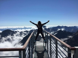 Photo by Nina Uhlikova: https://www.pexels.com/photo/person-standing-on-hand-rails-with-arms-wide-open-facing-the-mountains-and-clouds-725255/