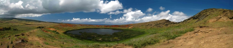 Rano Raraku's interior contains one of the island's three freshwater crater lakes bordered by totora reeds. (Paolop)