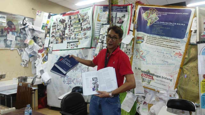 (Courtesy of Elim Advanced Technology Lab) The first excited expression of Prof. Elim after receiving his 1st Springer Nature book.