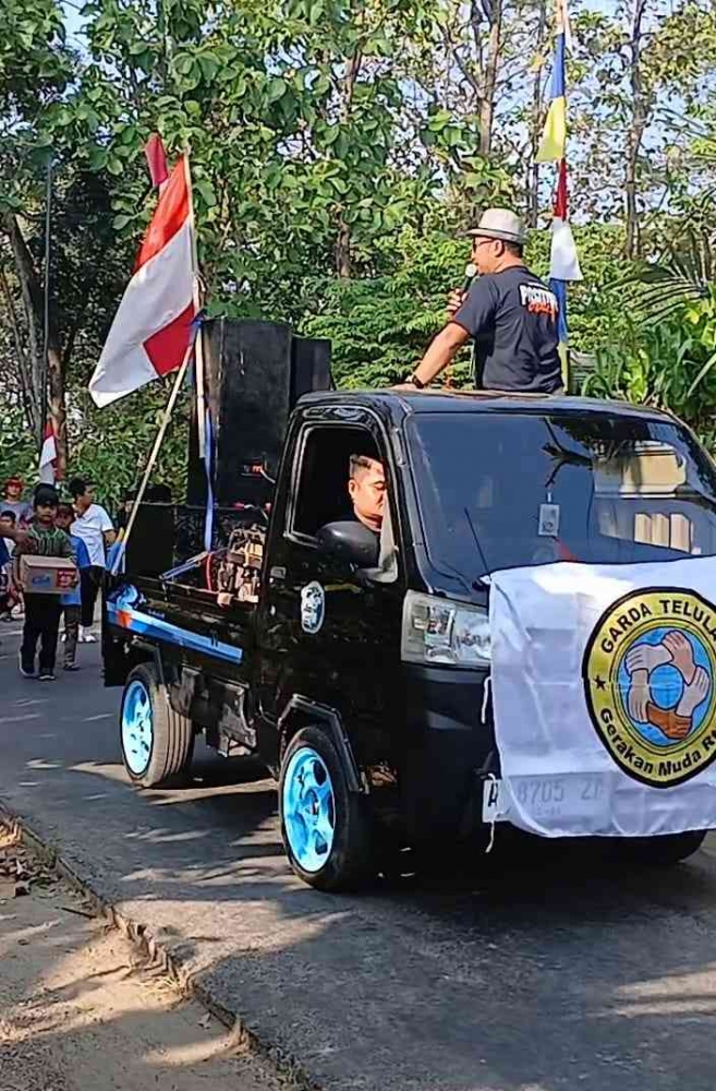 Jalan santai memperingati HUT RI ke 80 yang dikomandani Gerakan Muda RT 13, Krandegan Kebonsari Madiun (Dokpri: Isti Yogiswandani)