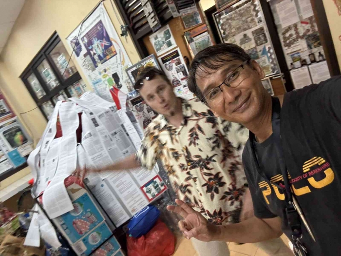 (Prof. Elim photo with Mr Peter from Russia) Papers tree at EAT Lab.