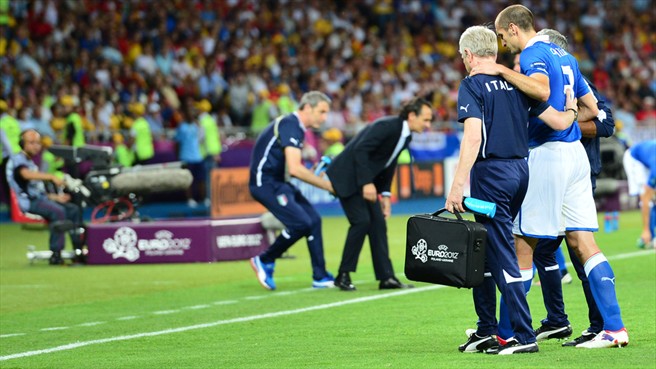 Giorgio Chiellini of Italy leaves the pitch after being injured during the UEFA EURO 2012 final against Spain