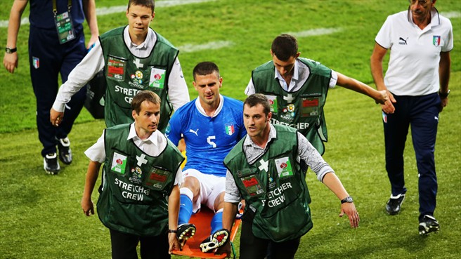 Thiago Motta of Italy is taken off the pitch on a stretcher injured during the UEFA EURO 2012 final against Spain