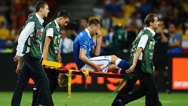 Thiago Motta of Italy is taken off the pitch on a stretcher injured during the UEFA EURO 2012 final against Spain