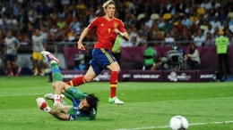 Fernando Torres of Spain scores their third goal past Gianluigi Buffon of Italy during their UEFA EURO 2012 final